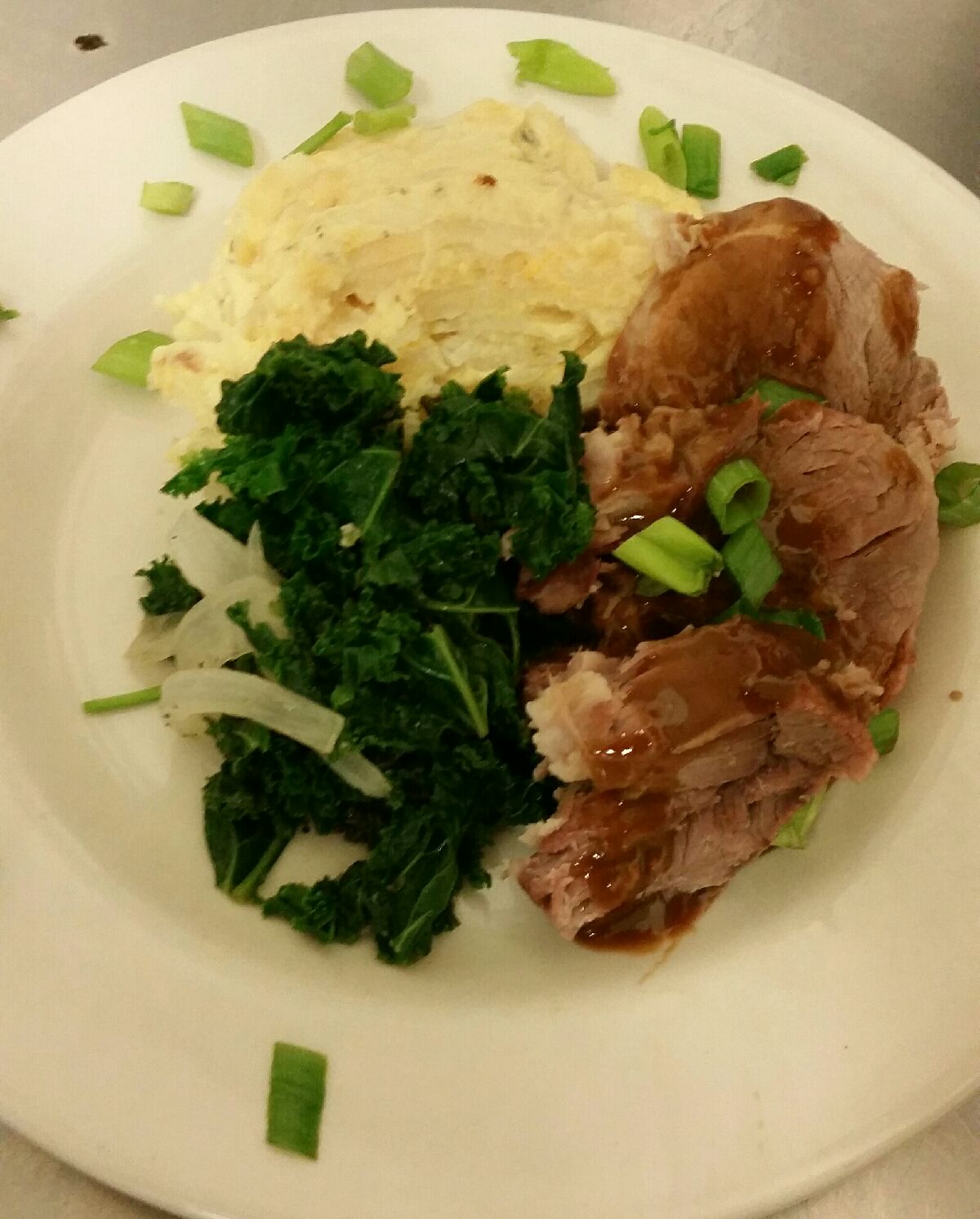 Braised pork with Au gratin potatoes and kale